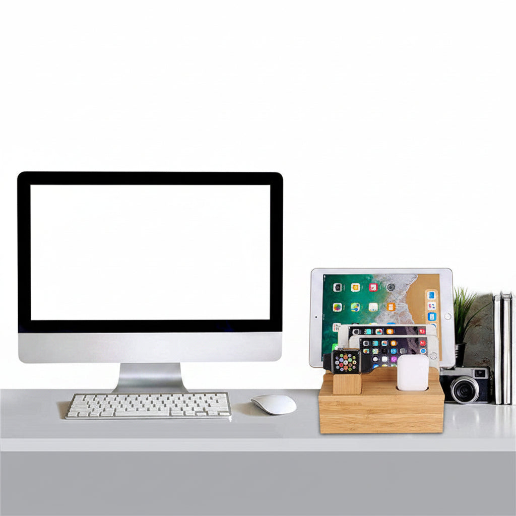 Modern office desk setup with computer, keyboard, mouse, and smartphone on a wooden stand against a brick wall.
